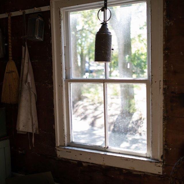 Tin lantern hanging in the window of the Park House Museum