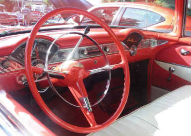 Picture of steering wheel of vintage car.