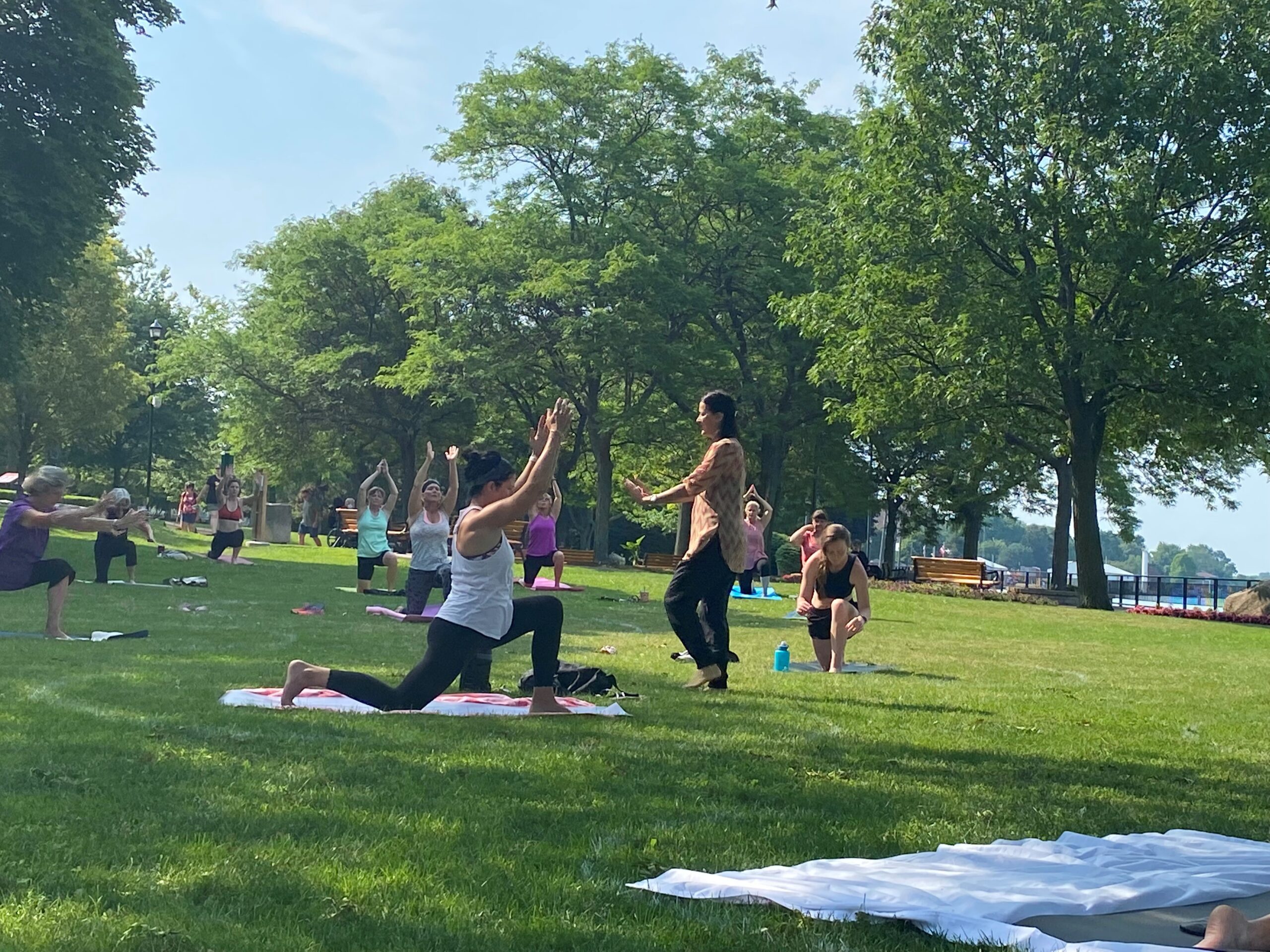 Group doing yoga on the park