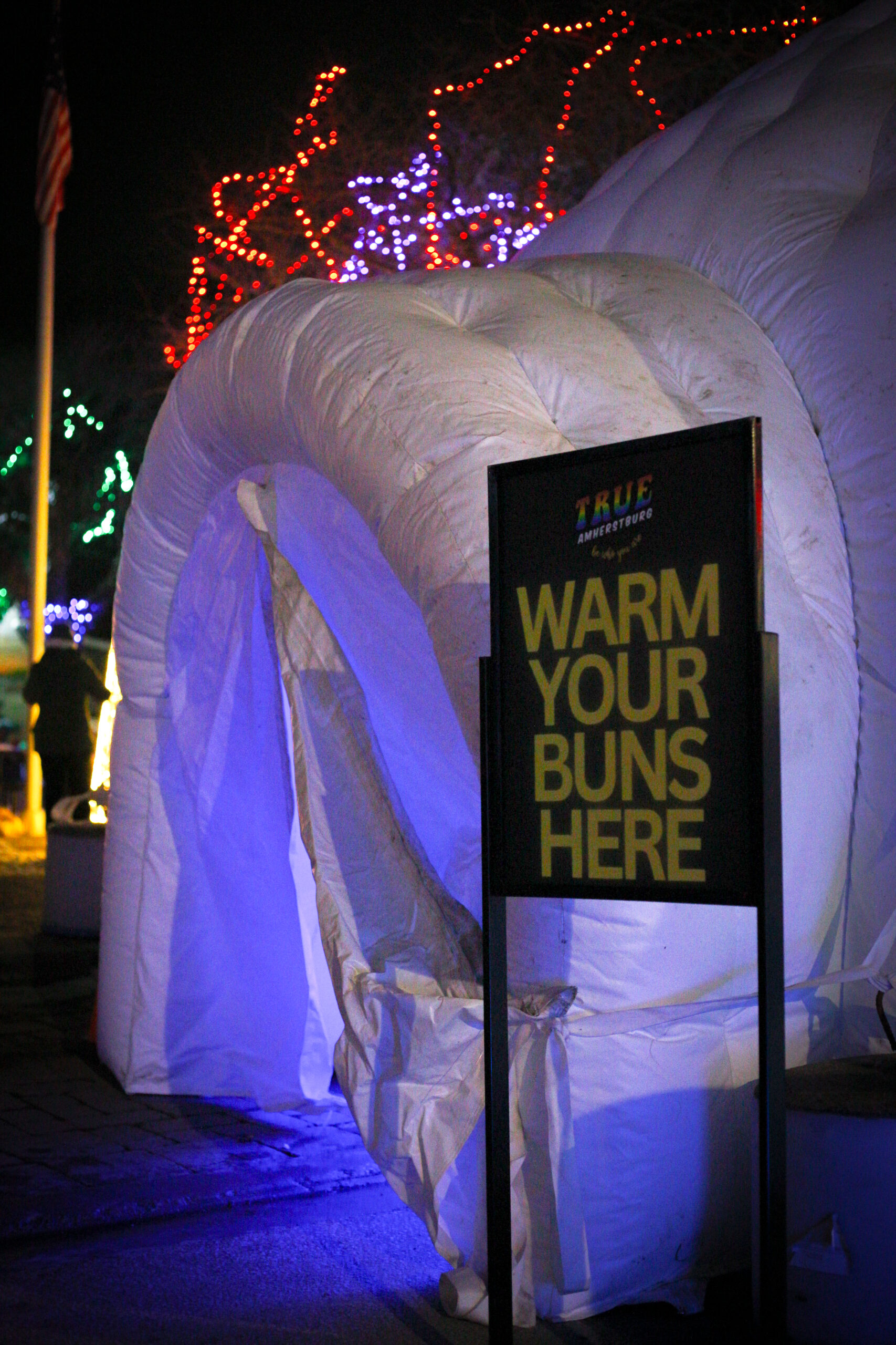 Igloo entrance with warm your buns sign