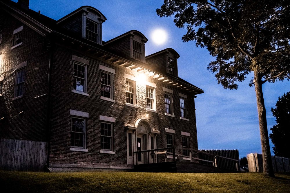 Outside of Fort Malden at night with a full moon