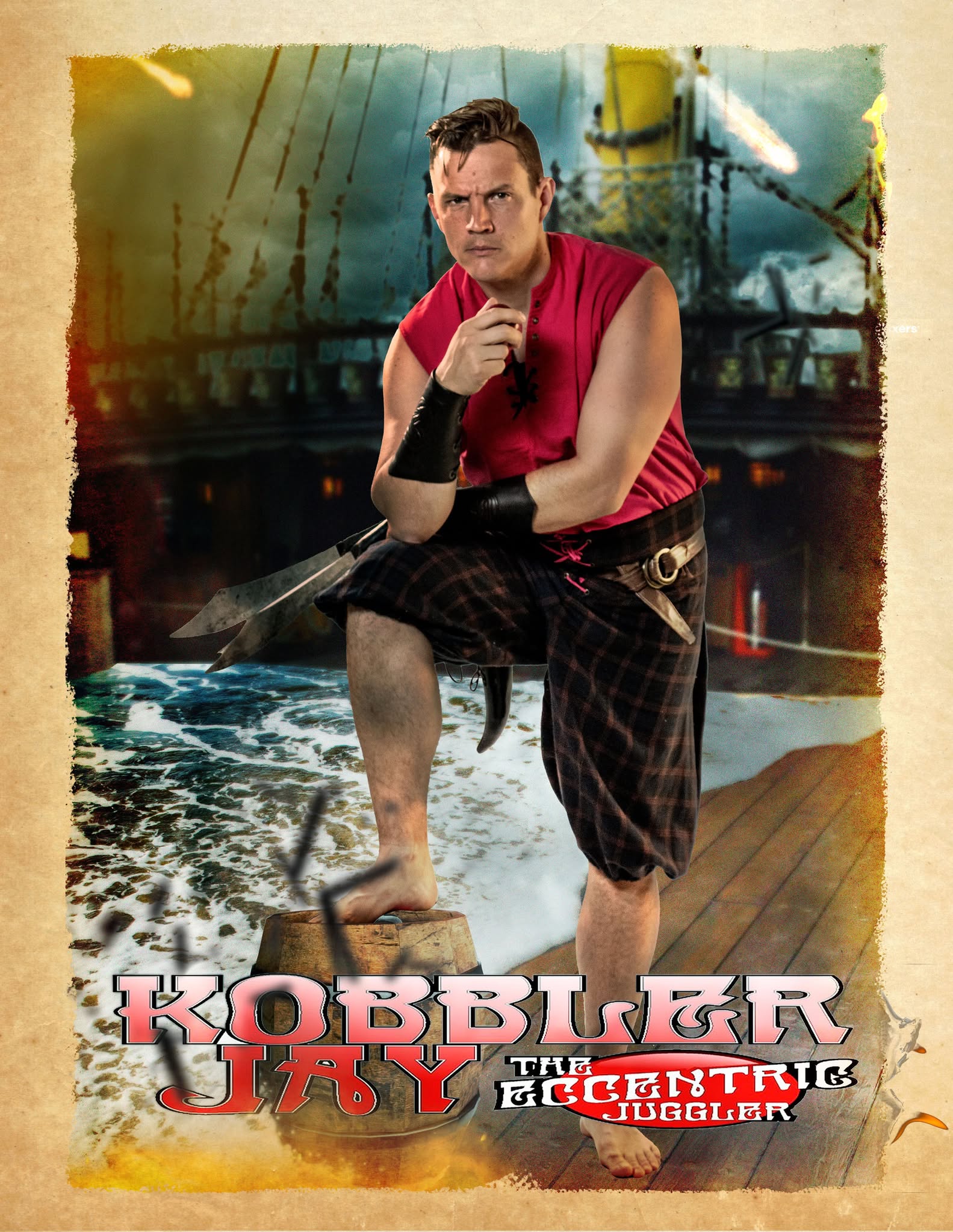 Kobbler Jay, the eccentric juggler posing with a pirate ship behind him