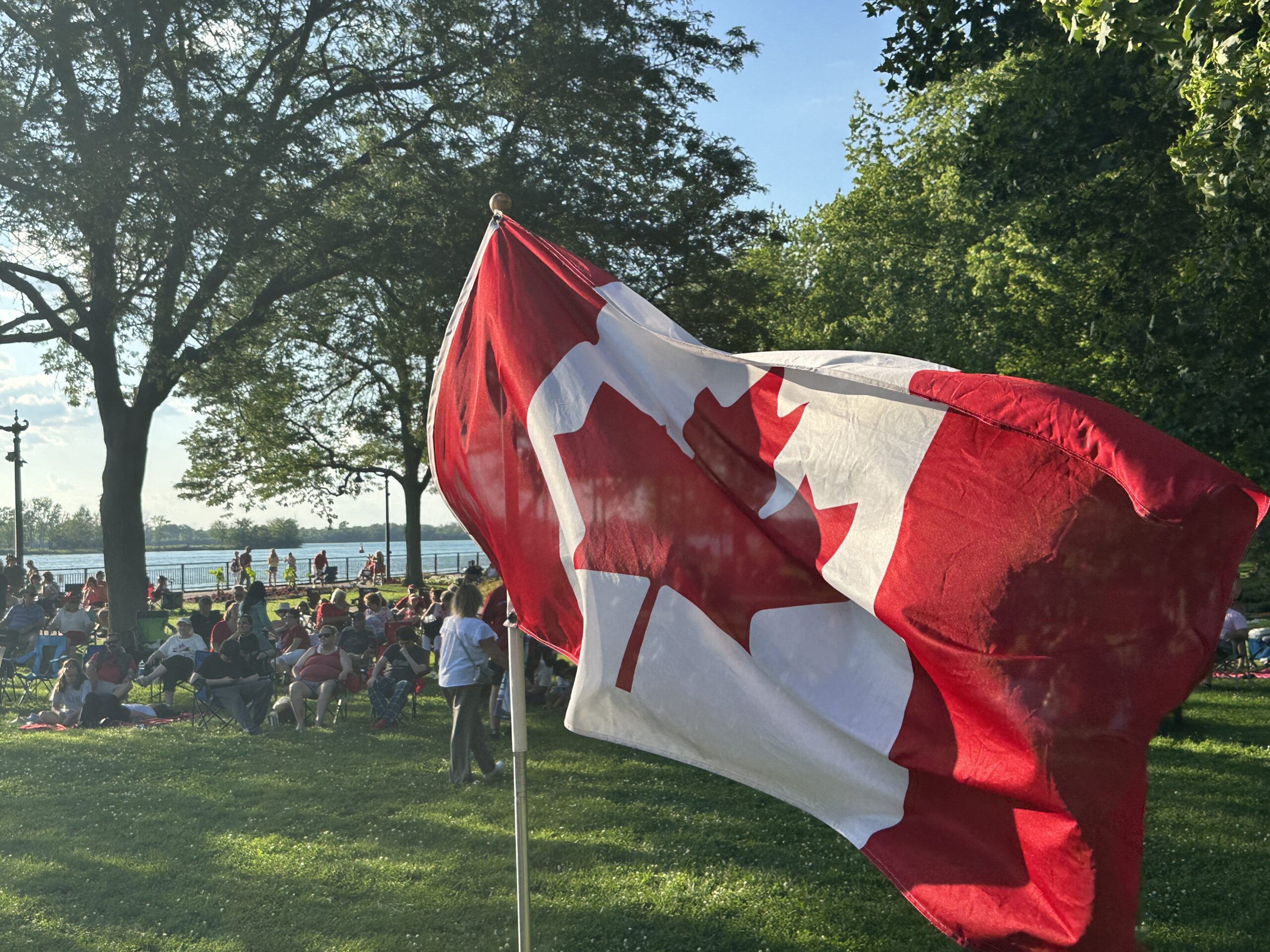 Canadian flag flowing in the wind in Kings Navy Yard Park on Canada Day
