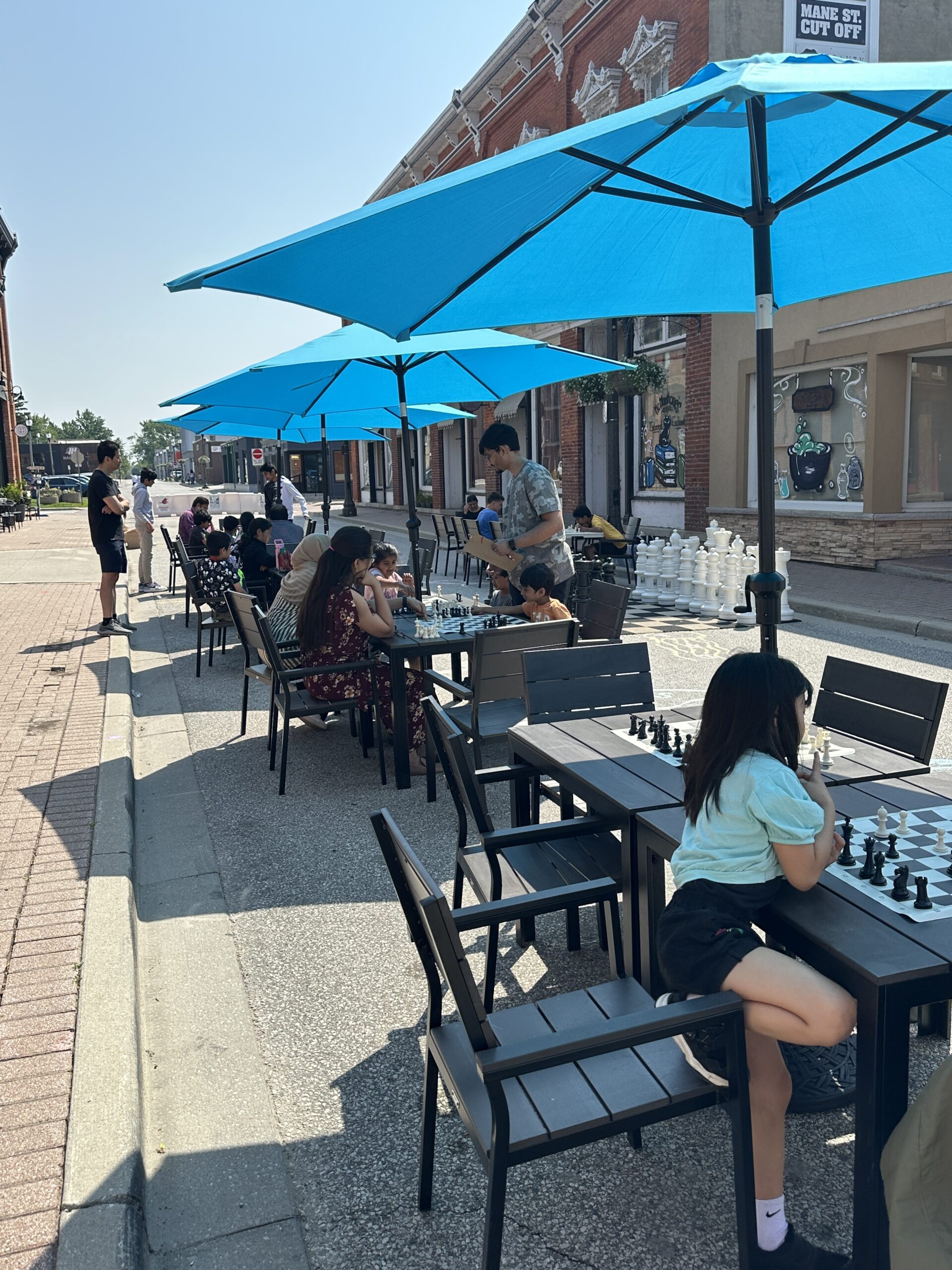 people playing chess on Murray street during Open Air weekends
