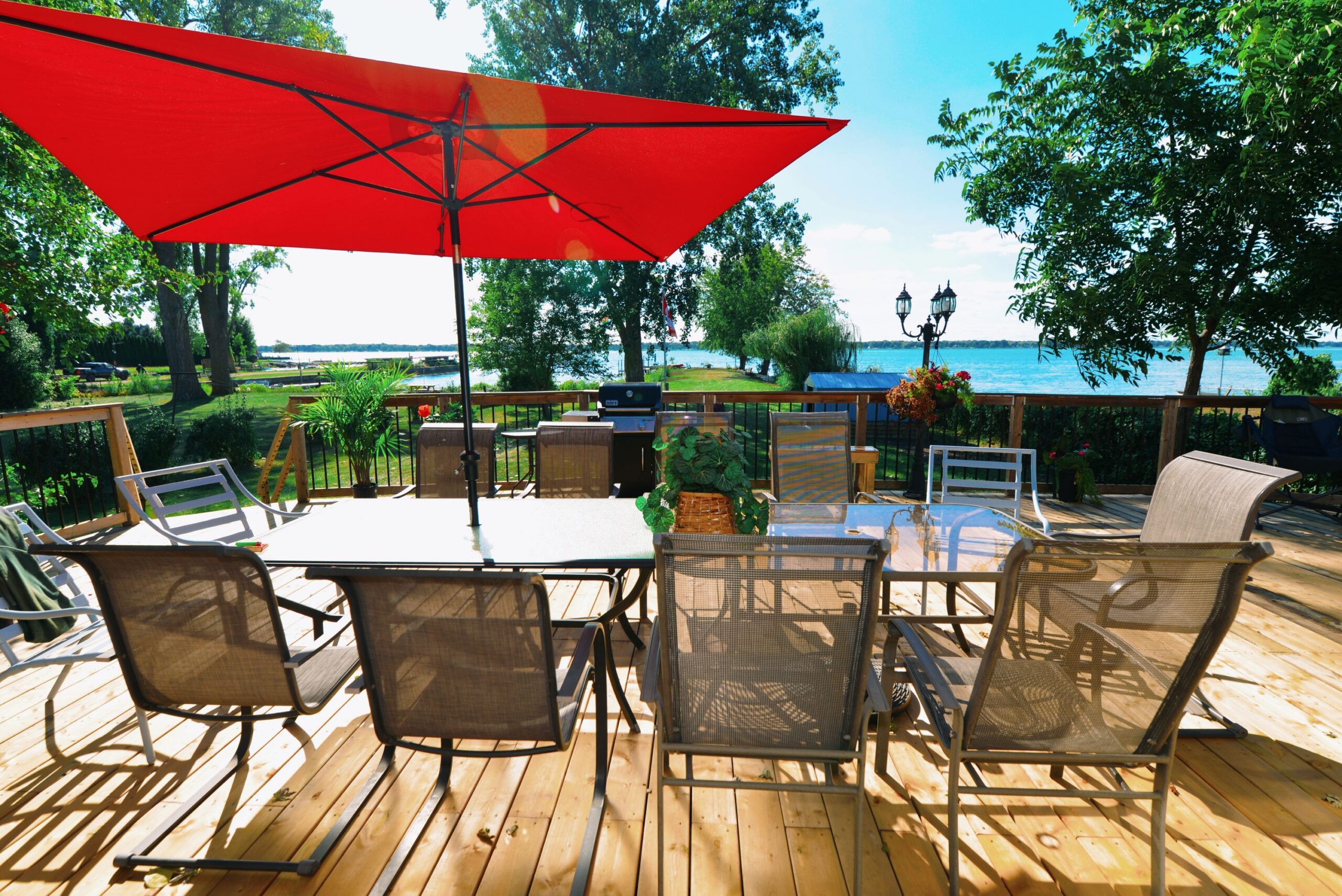 Patio table and chairs on a deck overlooking the lake