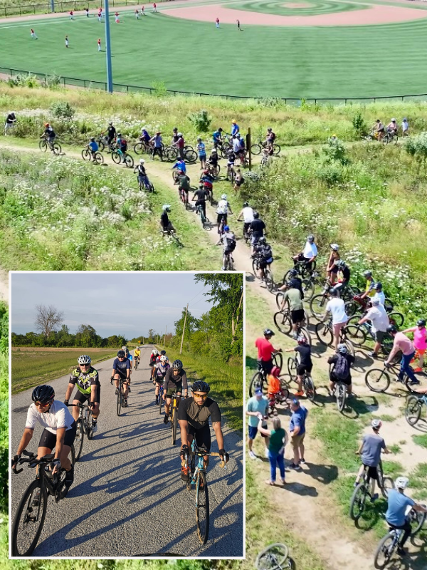 Cyclists riding on the bike trails at the Libro Centre with a baseball diamond in the background